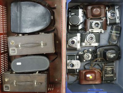 many different types of old cameras in this case