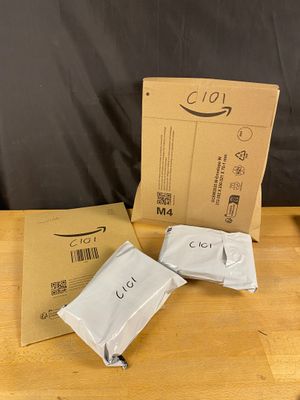 three packages of toilet paper sitting on top of a wooden table