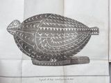 a black and white drawing of a decorative object on a piece of paper