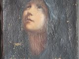 un vieux tableau représentant une femme portant un voile sur la tête