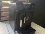a coffee machine sitting on top of a white table