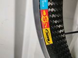 a close up of a bicycle tire with a sticker on it
