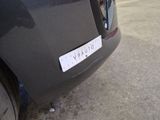 a close up of a car with a sticker on it ' s bumper