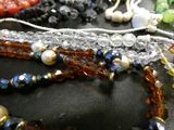 a lot of beads that are laying on a table