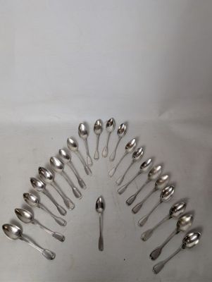 a lot of spoons arranged in a circle on the table