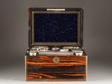 an image of a wooden box with silverware inside of it