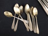 five spoons and two spoon spoons on a table