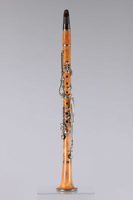 a clarinet with a wooden body and silver decorations on it