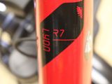 a close up of a red bike with a black handlebar