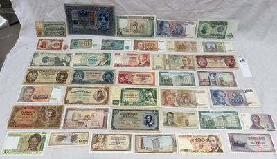 the collection of old and new currency is displayed on the table