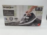 packaging of a black and white steam iron in a box