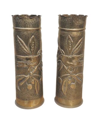 two vases that are sitting on a white surface