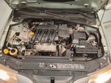 the engine of a car with its hood open and the hood down