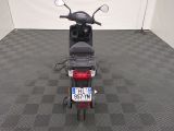 a motor scooter that is parked in a room