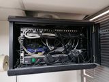 a black cabinet with many wires and wires in it