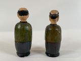 two figurines of two people with different colors