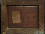 an old picture of a wooden frame with a stamp on it