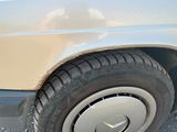 a close up of a car ' s tire on the side of the road