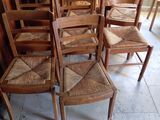 a lot of chairs that are lined up in a room