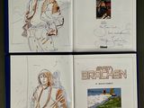 three books with drawings of a man and a woman on them