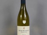 a bottle of white wine sitting on a table
