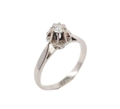 a close up of a diamond ring on a white background