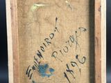an old picture of a painting with writing on it in a wooden frame