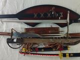 several different types of weapons are displayed on a white surface