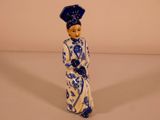 a figurine of a woman in a blue and white dress