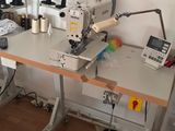 a sewing machine sitting on a table in a room