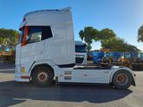 a white truck that is parked in a parking lot