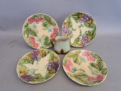 three plates and a cup sitting on top of a table