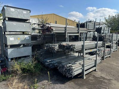 many piles of metal items in the parking lot