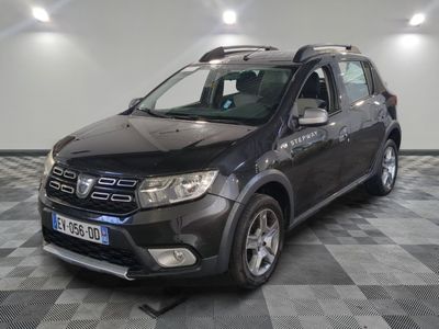 a picture of a black dacia parked on a checkered floor
