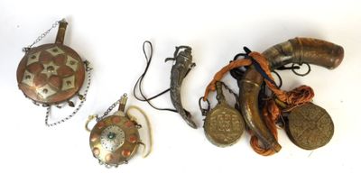 three pieces of jewelry on a white surface with a white background
