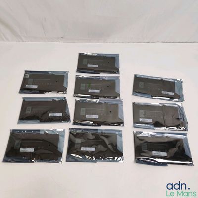 several bags of electronic equipment sitting on top of a white surface
