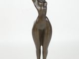 bronze statue of a woman holding her hands up