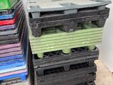 a lot of plastic crates stacked on top of each other
