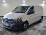 the mercedes van is parked on a checkered floor in a garage