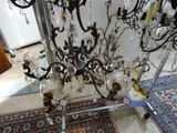a chandelier that has a lot of glass hanging from it