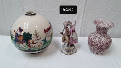 two vases sitting next to each other on a table