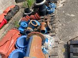 many different types of valves lined up on the side of the road