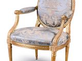 an image of a chair with a blue upholstered seat and gold trim