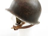 an old helmet on a mannequin head on a white surface
