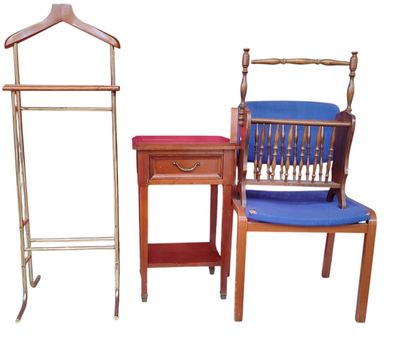 three chairs and a table with a coat rack on it