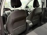 a car that has two seats in the back of it