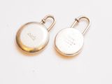 pair of silver plated pocket watches on a white surface