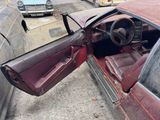 a car that is sitting in the street with its door open