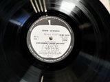 a black record with a label on it sitting on a table