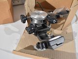 a box with a clamp in it sitting on a table